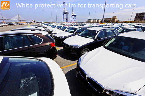 Últimas noticias de la empresa sobre Coche blanco que pinta la película protectora para transportar los coches