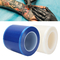 Carrete de película dental dinámico de la barrera con la película azul adhesiva de la barrera de la caja del dispensador para dental, médico y el tatuaje